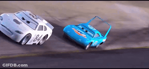 Two Cars Racing On Race Track GIF