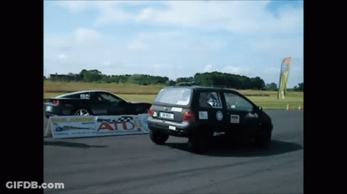 Two Cars Racing On Track With ATD Sign GIF