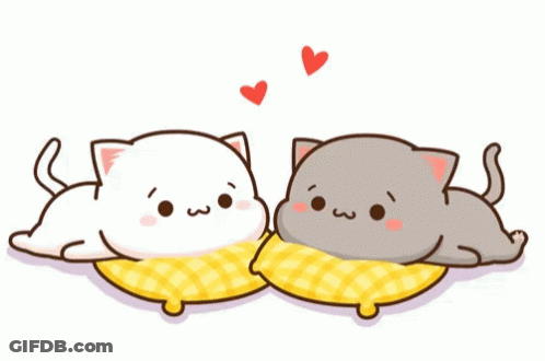 Two Cartoon Cats Are Laying On Pillows With Hearts Surrounding Them GIF