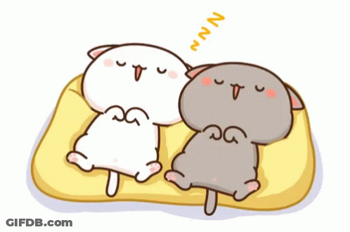 Two Cartoon Cats Sleeping One Yawning On Yellow Blanket GIF
