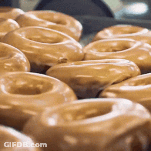 Two Cartoon Characters Eating Donuts From Regular Show GIF