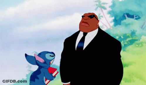 Two Cartoon Characters In Suits Holding Book GIF