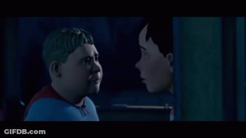 Two Cartoon Characters Looking At Each Other In Dark GIF