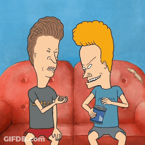 Two Cartoon Characters On Couch One Wearing Metallica Shirt GIF
