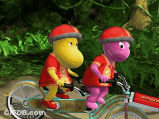 Two Cartoon Characters Riding Tandem Bicycle GIF