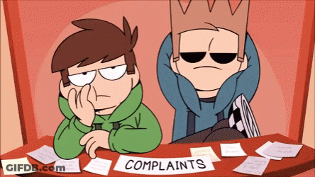 Two Cartoon Characters Sit At A Table With A Sign That Says " Complaints " GIF