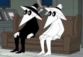 Two Cartoon Characters Sitting Crossed Legs GIF