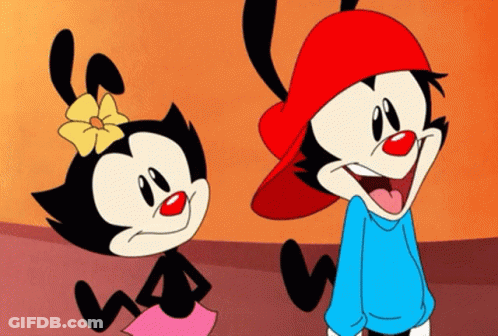 Two Cartoon Characters Standing And Smiling GIF