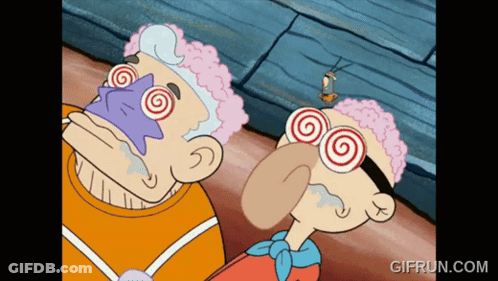 Two Cartoon Characters With Hypnotic Glasses GIF
