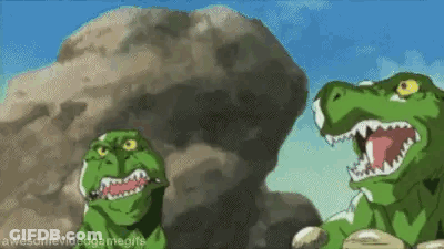 Two Cartoon Dinosaurs Standing Next To Each Other In Front Of Rock GIF