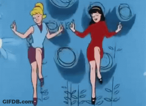Two Cartoon Girls Are Dancing In Front Of A Blue Wall With Circles On It . GIF