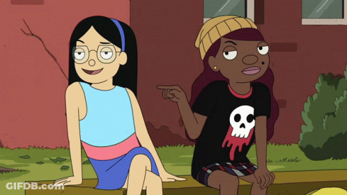 Two Cartoon Girls On Bench, One In Skull Shirt GIF
