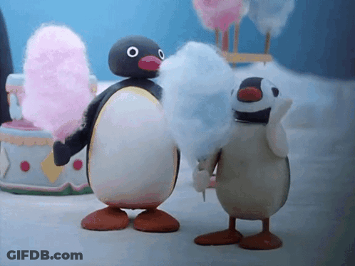 Two Cartoon Penguins Eating Cotton Candy GIF