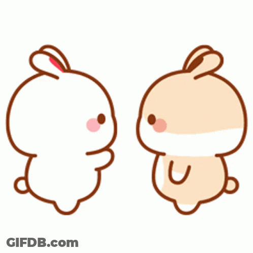 Two Cartoon Rabbits Are Hugging Each Other And Holding A Heart . GIF