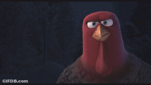 Two Cartoon Turkeys Are Standing Next To Each Other In The Dark GIF