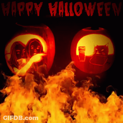 Two Carved Pumpkins Surrounded By Fire Saying Happy Halloween GIF