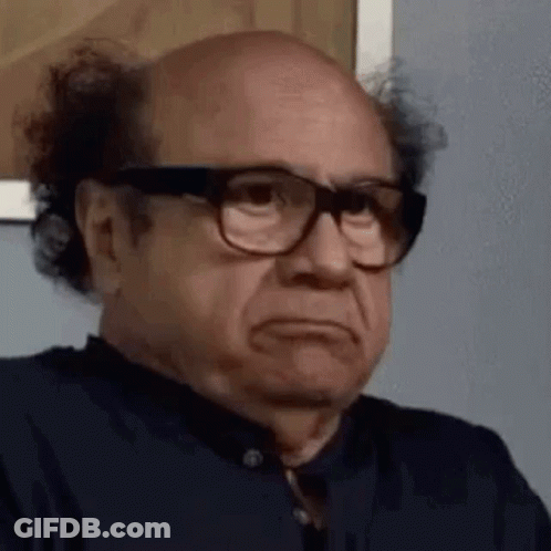 Two Cats In Reindeer Antlers Lying On Bed GIF