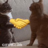 Two Cats Shaking Hands On A Couch With A Yellow Hand GIF