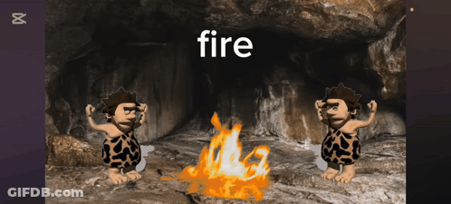 Two Cavemen Are Standing In Front Of A Fire With The Word Fire Below Them GIF