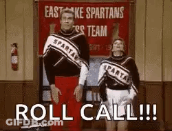 Two Cheerleaders Are Standing Next To Each Other In Front Of A Sign That Says `` Roll Call !!! '' . GIF