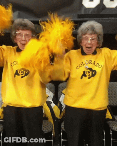 Two Cheerleaders In Yellow Sweaters Saying Colorado GIF