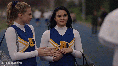 Two Cheerleaders With Letter R On Jersey GIF