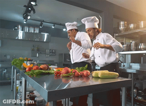 Two Chefs Preparing Food With Vegetables GIF