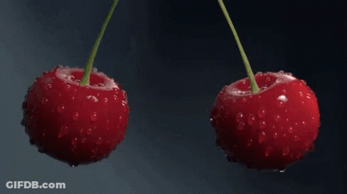 Two Cherries Splashed In Water GIF