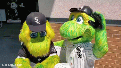 Two Chicago White Sox Mascots Are Sitting On A Bench In Front Of A Brick Wall GIF