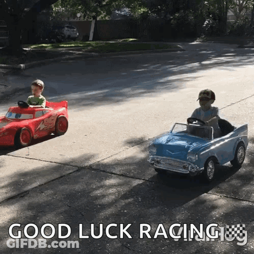 Two Children Are Driving Toy Cars On A Street With The Words Good Luck Racing GIF