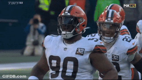 Two Cleveland Browns Players Number 90 And 32 GIF