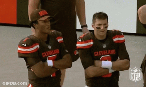 Two Cleveland Football Players Standing Crossed Arms GIF