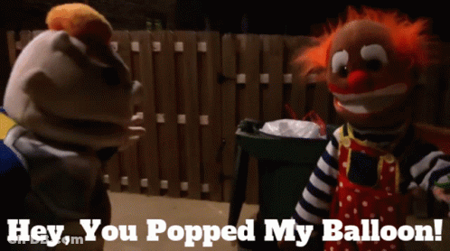 Two Clown Puppets Are Standing Next To Each Other With The Words Hey You Popped My Balloon Below Them GIF