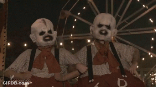 Two Clowns Standing In Front Of Ferris Wheel Insomniac GIF