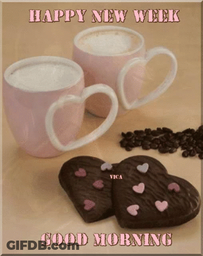 Two Coffee Cups With Heart Handles Next To Heart Cookies GIF