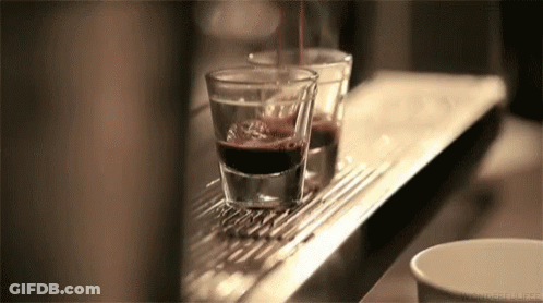 Two Coffee Glasses Being Poured GIF