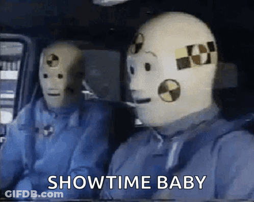 Two Crash Test Dummies In Car Saying Showtime Baby GIF