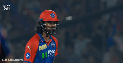Two Cricket Players Standing Next To Each Other GIF