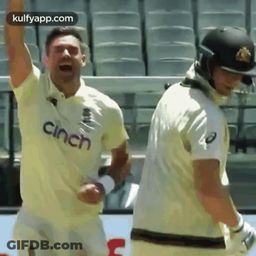 Two Cricket Players Standing On Field GIF
