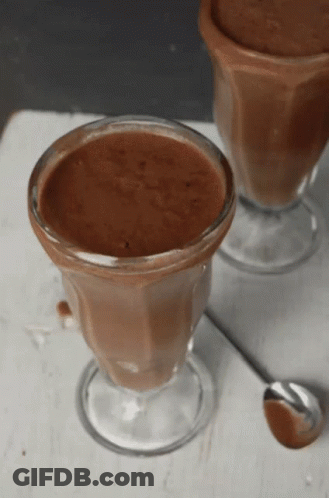 Two Cups Of Chocolate Mousse With A Spoon GIF