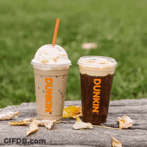 Two Cups Of Dunkin ' Coffee Are On A Table GIF