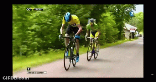 Two Cyclists Riding With Number 3 GIF