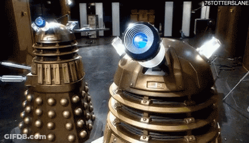 Two Dalek Robots Beside Each Other With 76Totterslane GIF