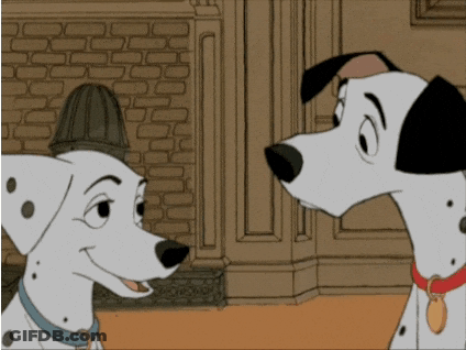 Two Dalmatian Dogs Looking At Each Other In A Cartoon GIF