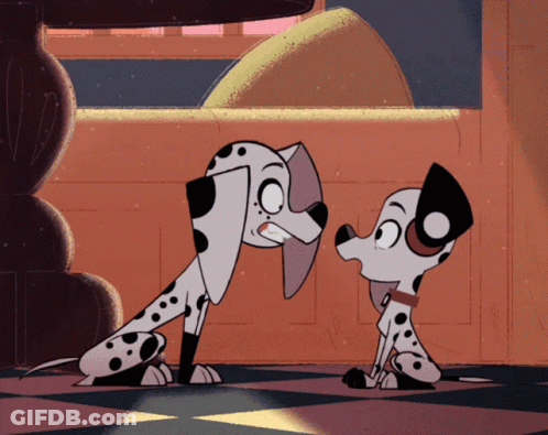 Two Dalmatian Dogs Standing Together GIF