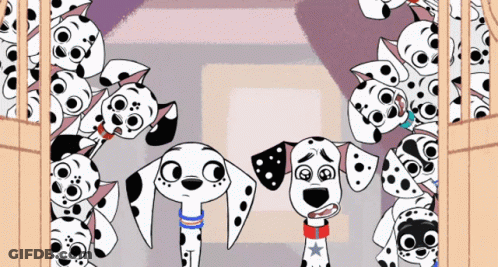 Two Dalmatian Dogs Standing With Puppies GIF