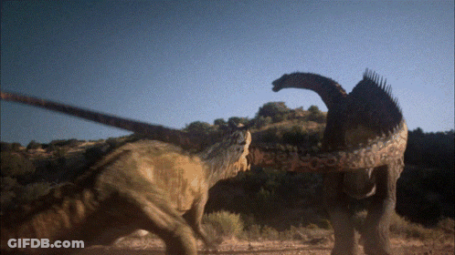 Two Dinosaurs Beside Trees GIF