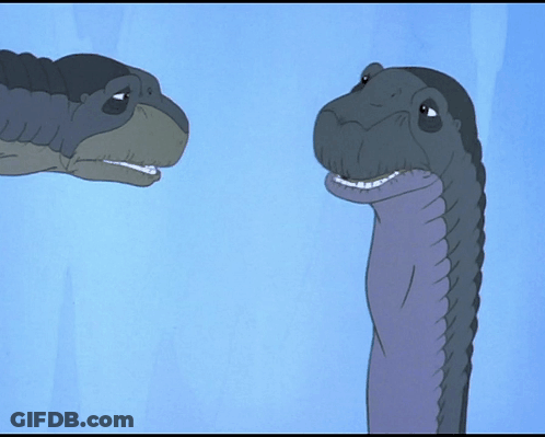 Two Dinosaurs One Smiling GIF