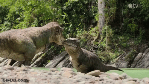 Two Dinosaurs Standing In River GIF
