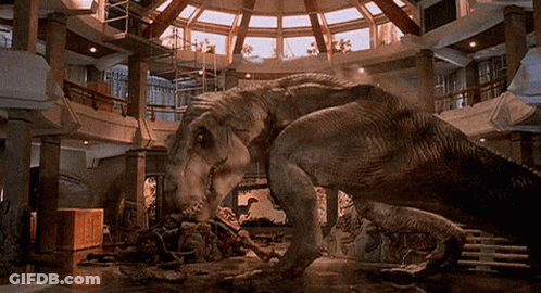 Two Dinosaurs Standing In Room GIF